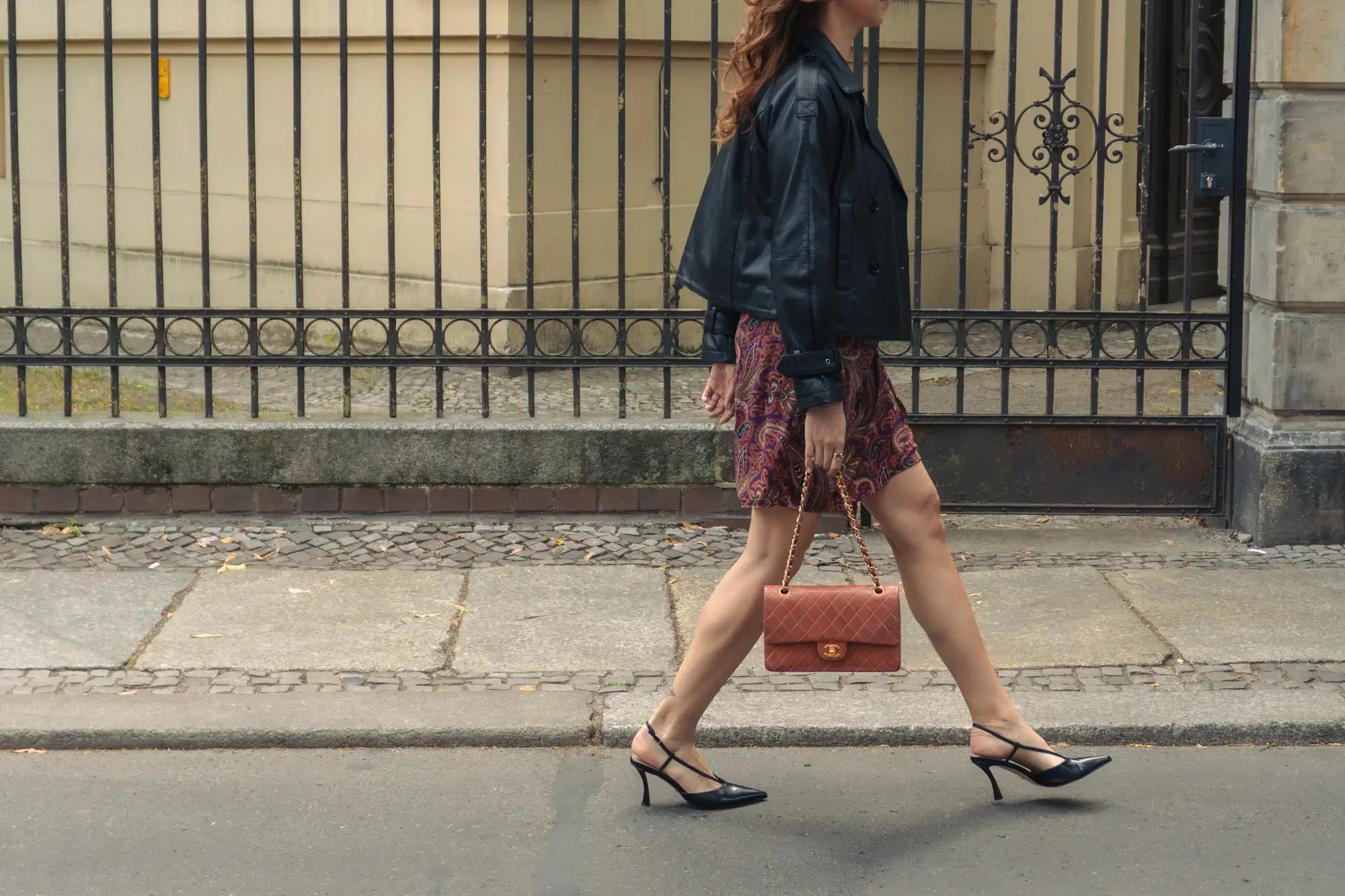 woman walking with vintage medium classic flap in red