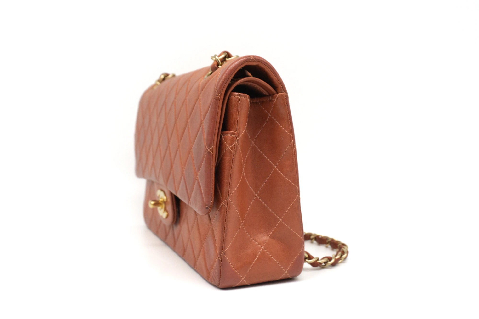 Chanel Medium Classic Flap in rust red side view left