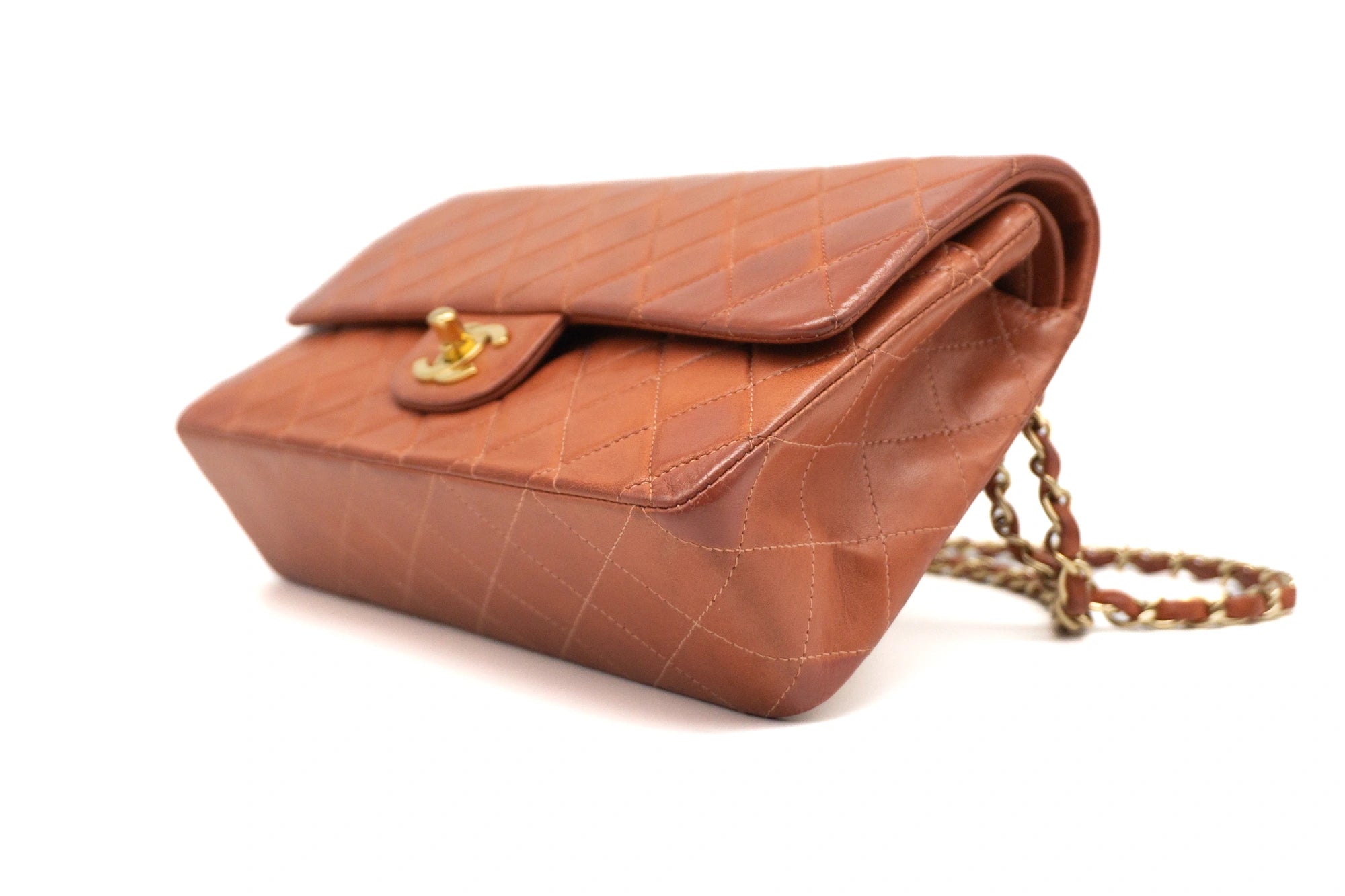 Chanel Medium Classic Flap in rust red bottom left view